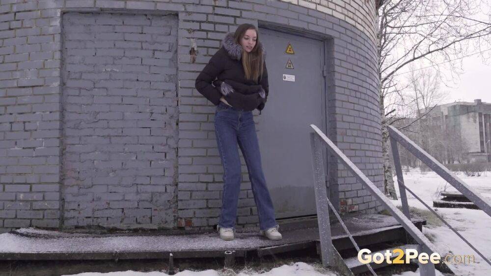 White girl pulls down her jeans to pee in the snow behind a building - #3