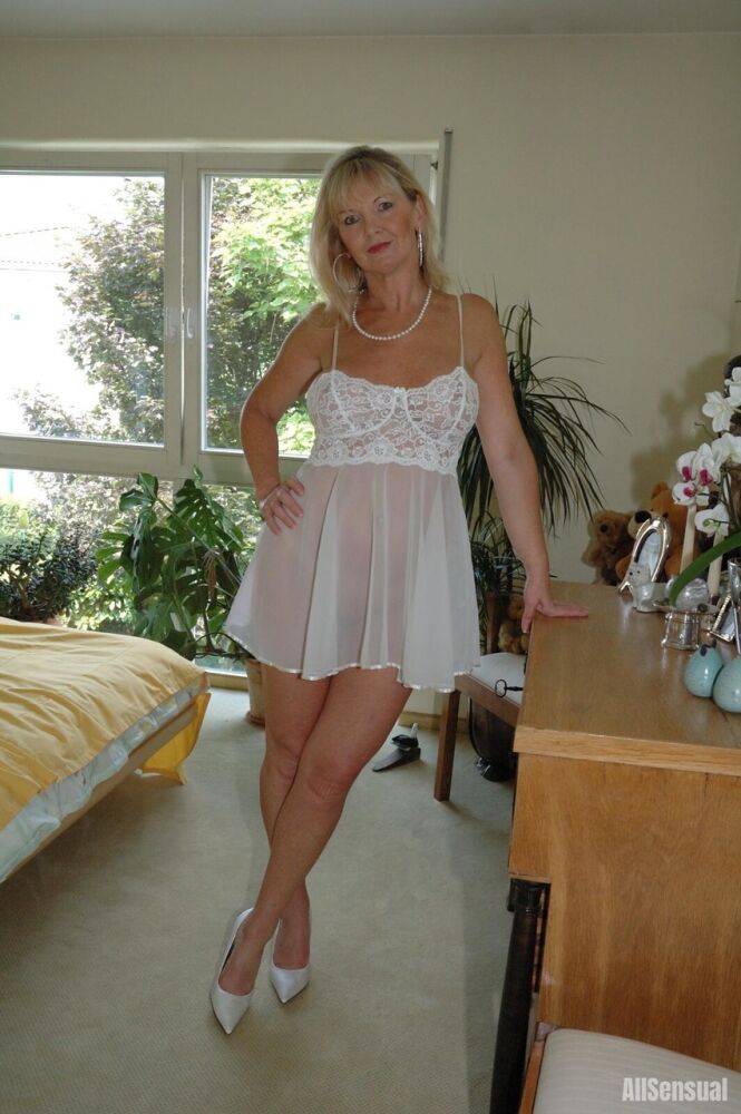 Busty blonde Marlen posing in a white negligee in the bedroomBig - #2