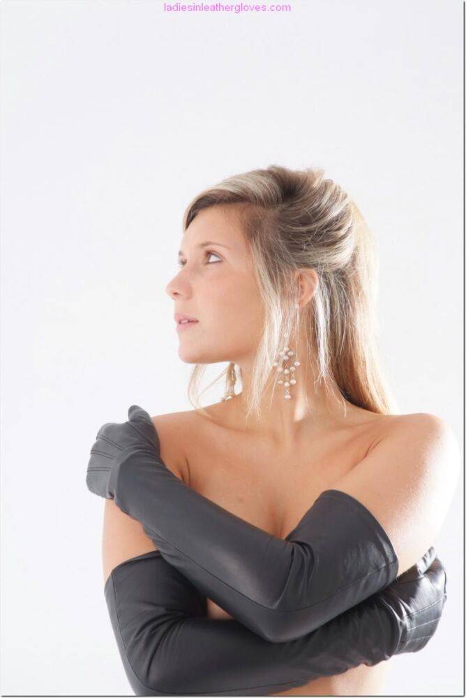 Blonde female touches her firm tits while wearing long leather gloves - #14