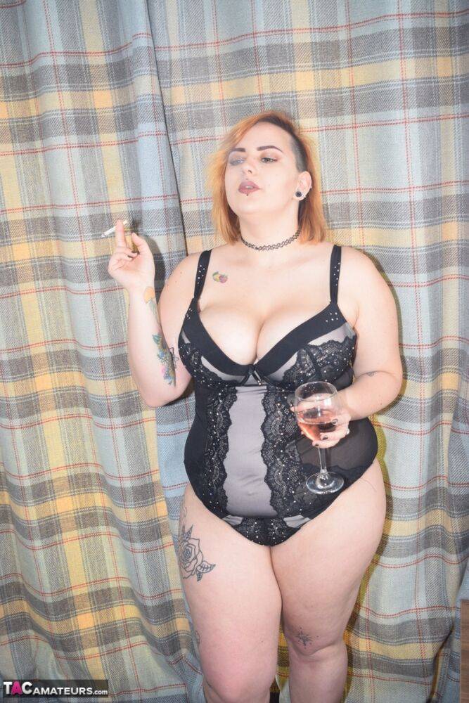 Tattooed BBW smokes and drinks while peeling off her lingerie - #12