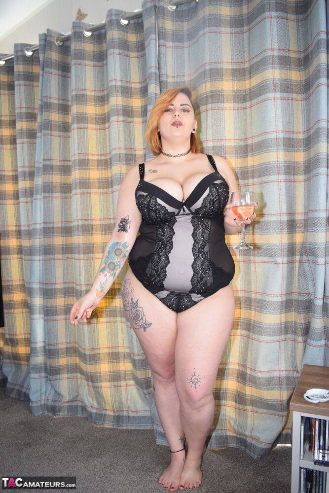 Tattooed BBW smokes and drinks while peeling off her lingerie - #9