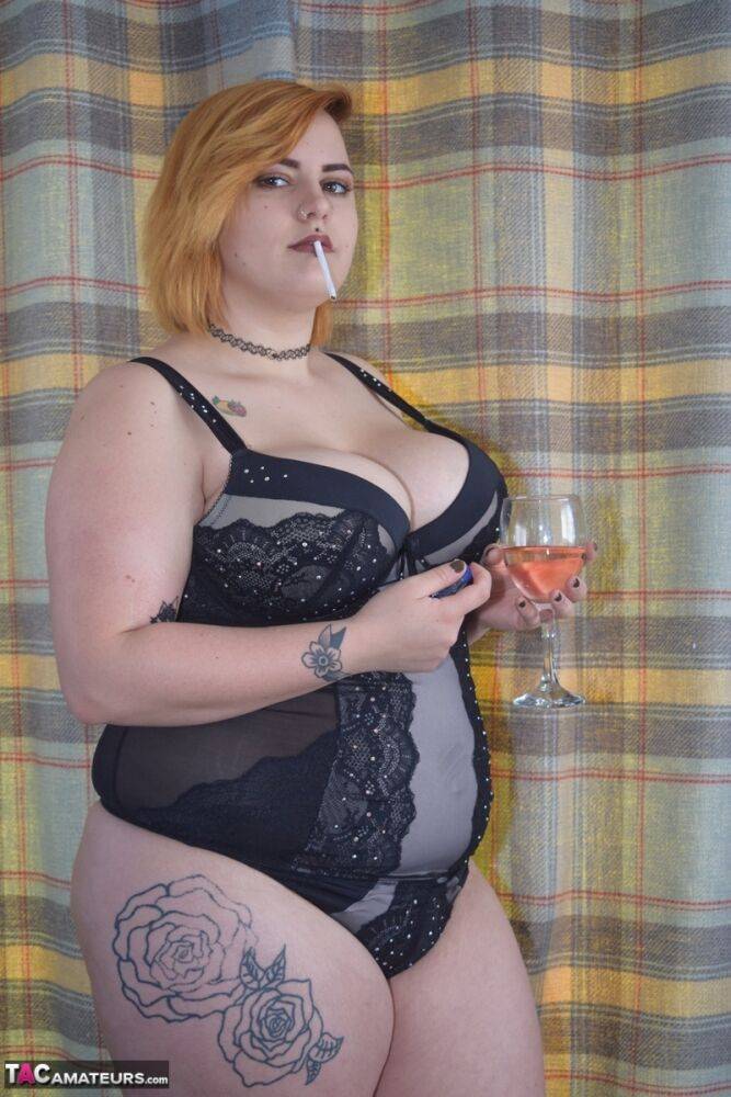 Tattooed BBW smokes and drinks while peeling off her lingerie - #16