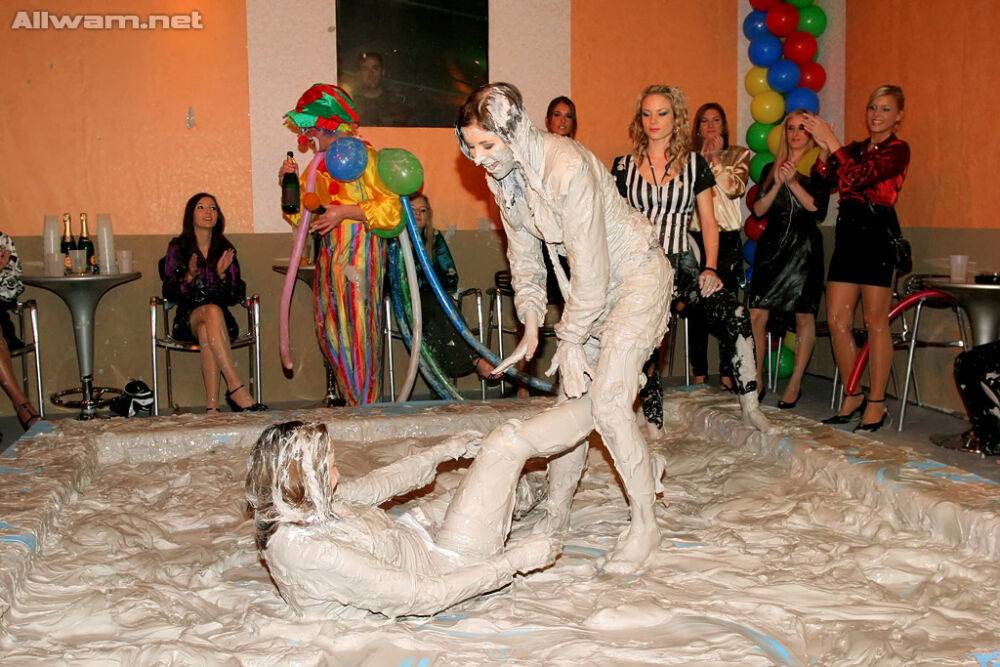 Seductive fetish ladies get involved in fully clothed mud wrestling - #1