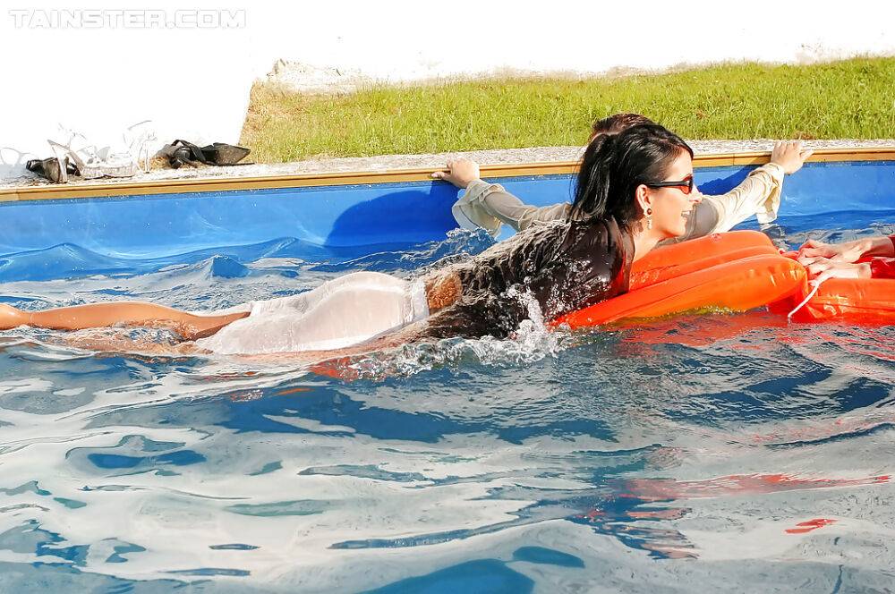 Fetish ladies have some wet fully clothed fun with her friends at the poolside - #7