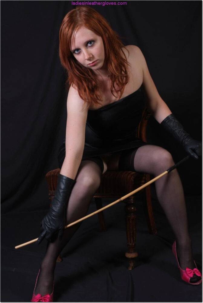 Sexy redhead flexes a cane before touching her tight slit with leather gloves - #3