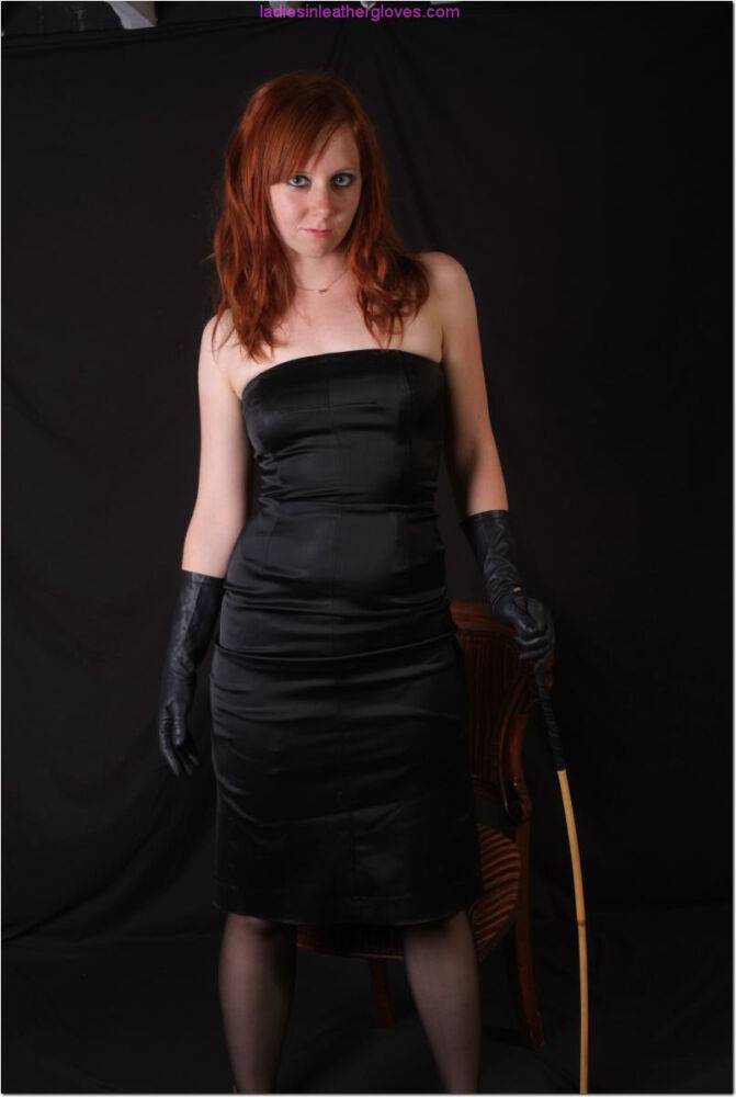 Sexy redhead flexes a cane before touching her tight slit with leather gloves - #11