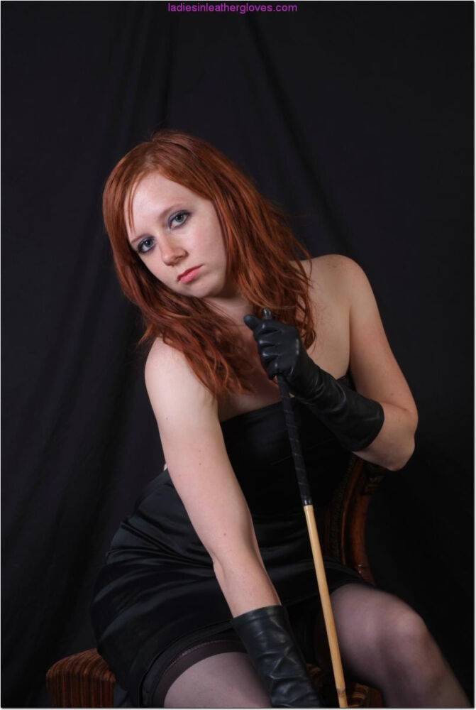 Sexy redhead flexes a cane before touching her tight slit with leather gloves - #13