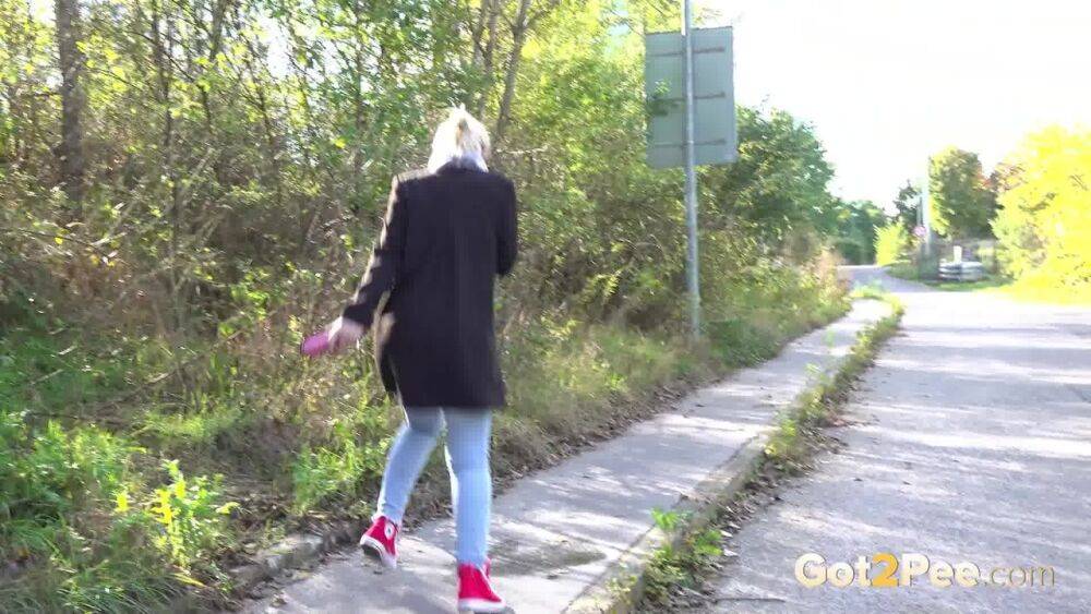 Pretty blonde Di Devi pulls down her jeans to pee on a public sidewalk - #13