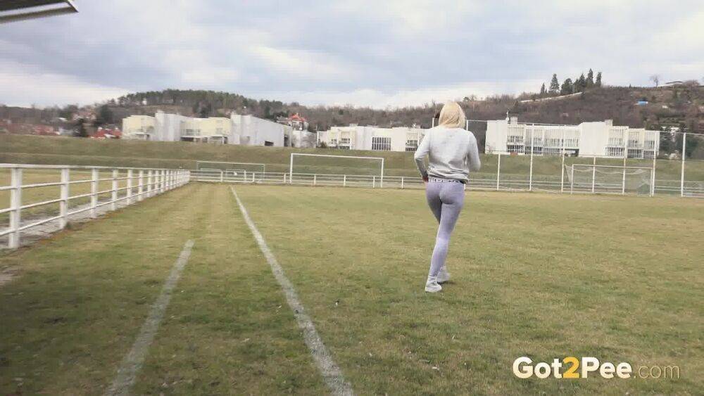 Blonde Katy Sky pisses next to a football field - #14