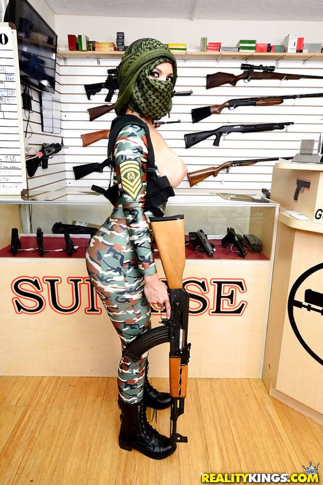 Camouflaged chick with rifle in hand lets her big natural breasts loose - #10