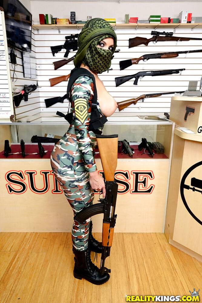 Camouflaged chick with rifle in hand lets her big natural breasts loose - #2