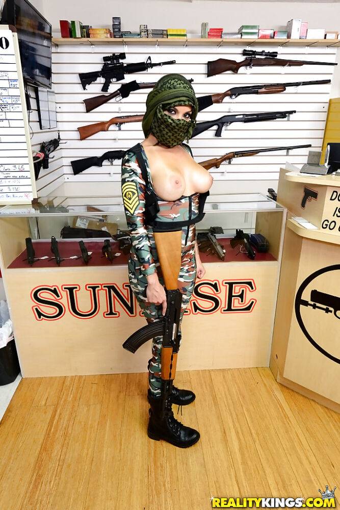 Camouflaged chick with rifle in hand lets her big natural breasts loose - #4