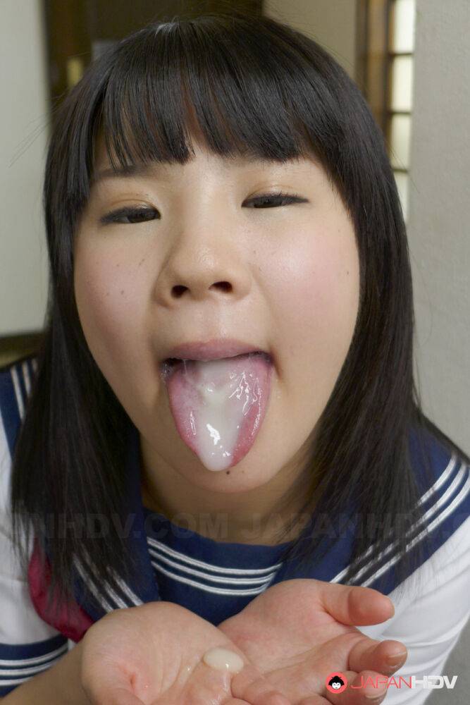 Adorable Asian schoolgirl Ami Oya gives fellatio and pees before a facial - #17