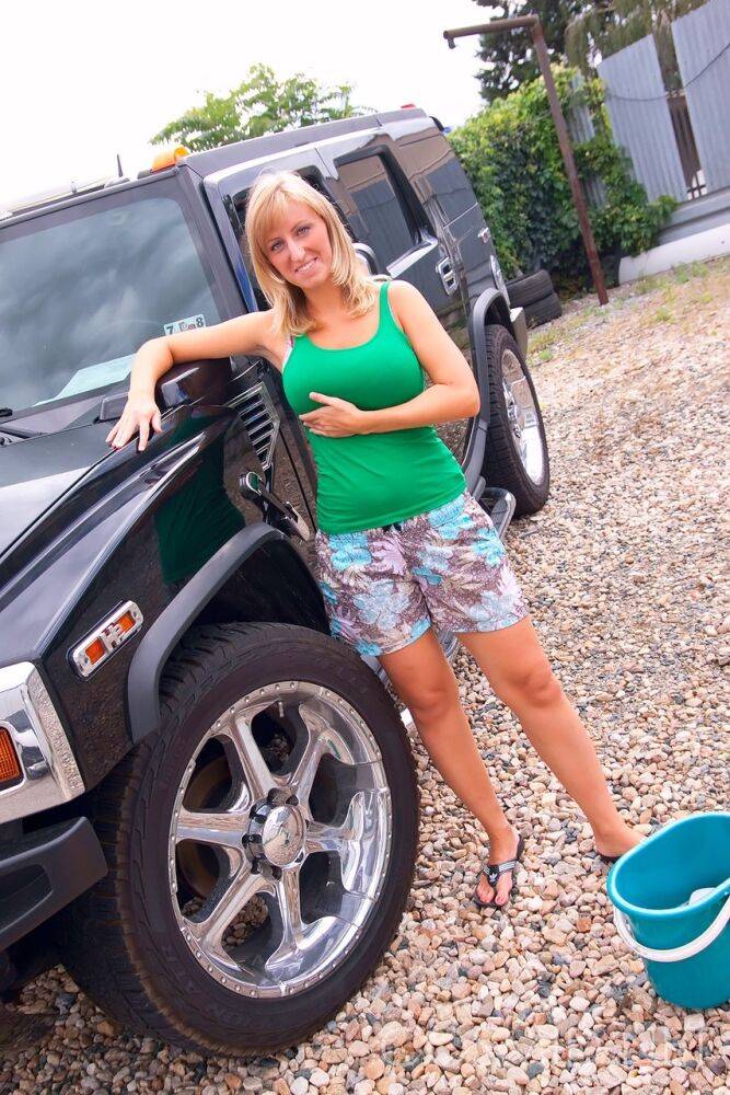 Mature blonde amateur Nikol washed her SUV with her big tits and hot ass bare - #12