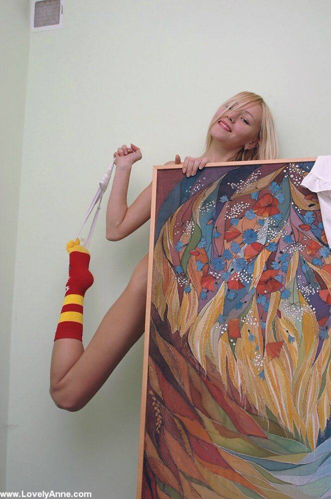 Charming blonde teen gets naked while wearing a pair of socks - #11