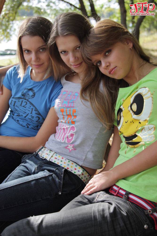 3 young girls remove T-shirts and jeans to model naked on park bench - #1