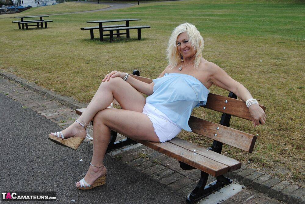 Mature platinum blonde lady lets her big saggy tits free in the outdoors - #13