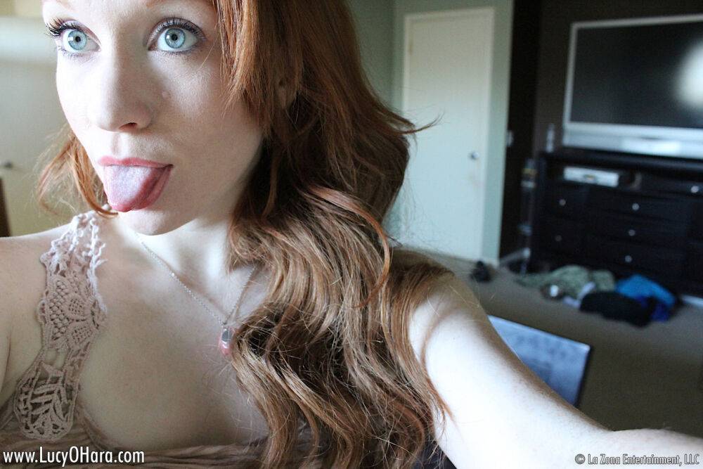 Pale redhead Lucy OHara takes selfies while fooling around on her bed on day - #14