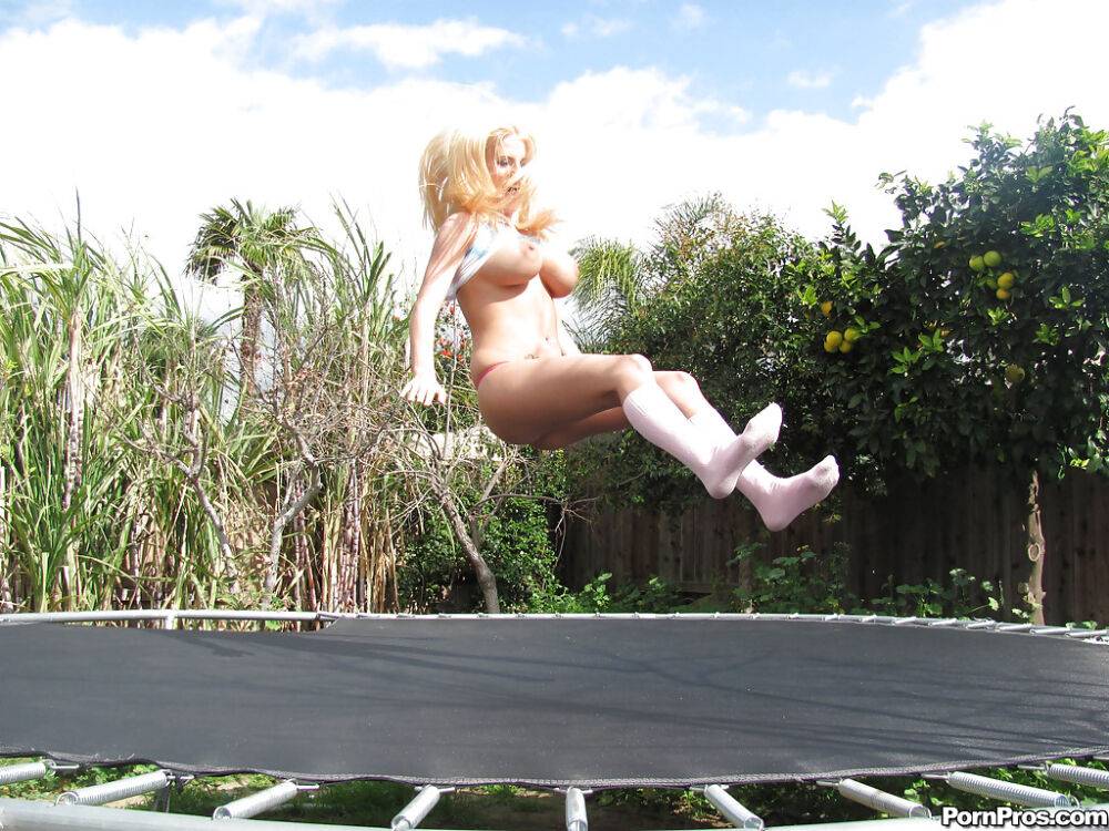 18 year old blonde Halie Cummings baring big boobs on trampoline outdoors - #3