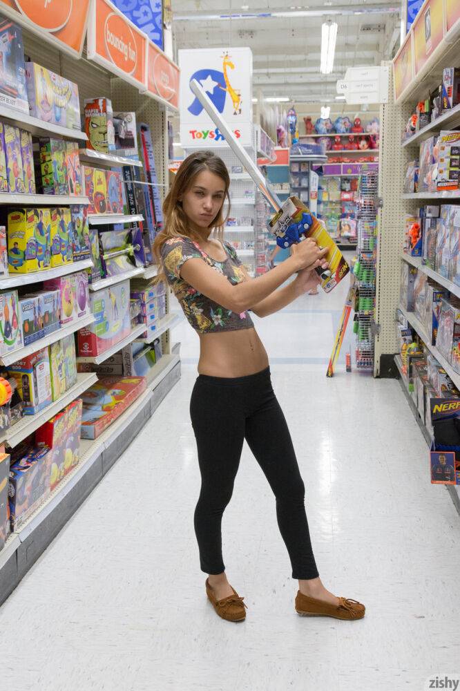Teen girlfriend Uma Jolie flashing her titties and her ass in a toy store - #4