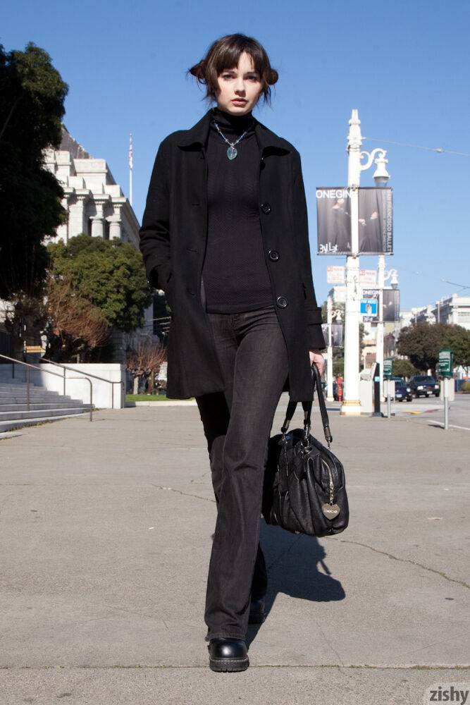 Sexy brunette showing off her long legs in fashionable jeans and body suit - #7