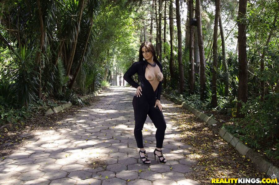 Big bottomed Latina beauty Cristine Castellari posing fully clothed outside - #15