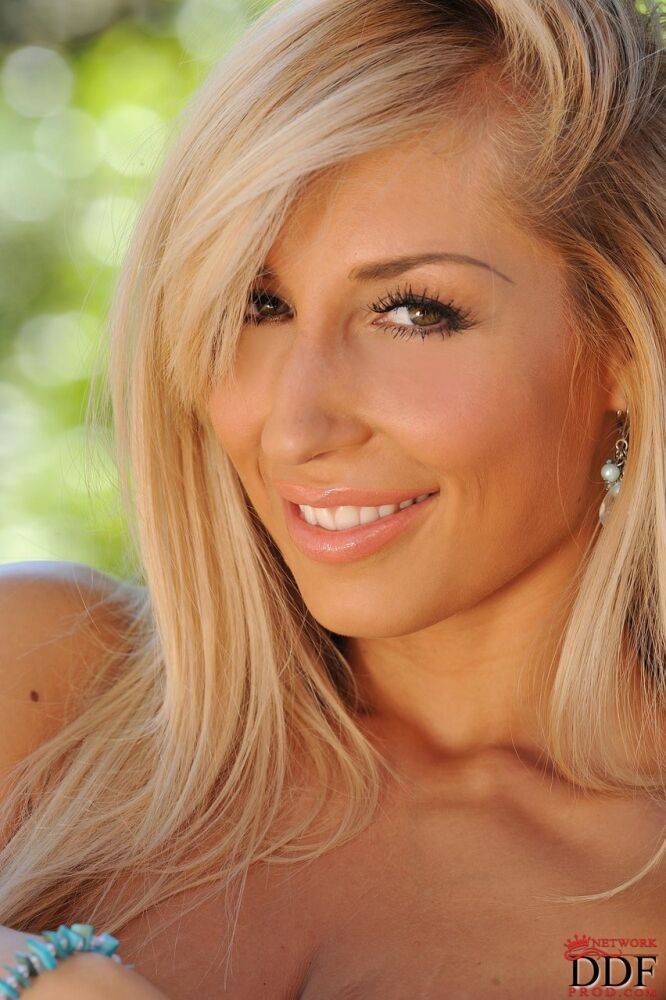 Blonde seductress Sexy Venera flaunting her saggy natural tits outdoors - #21