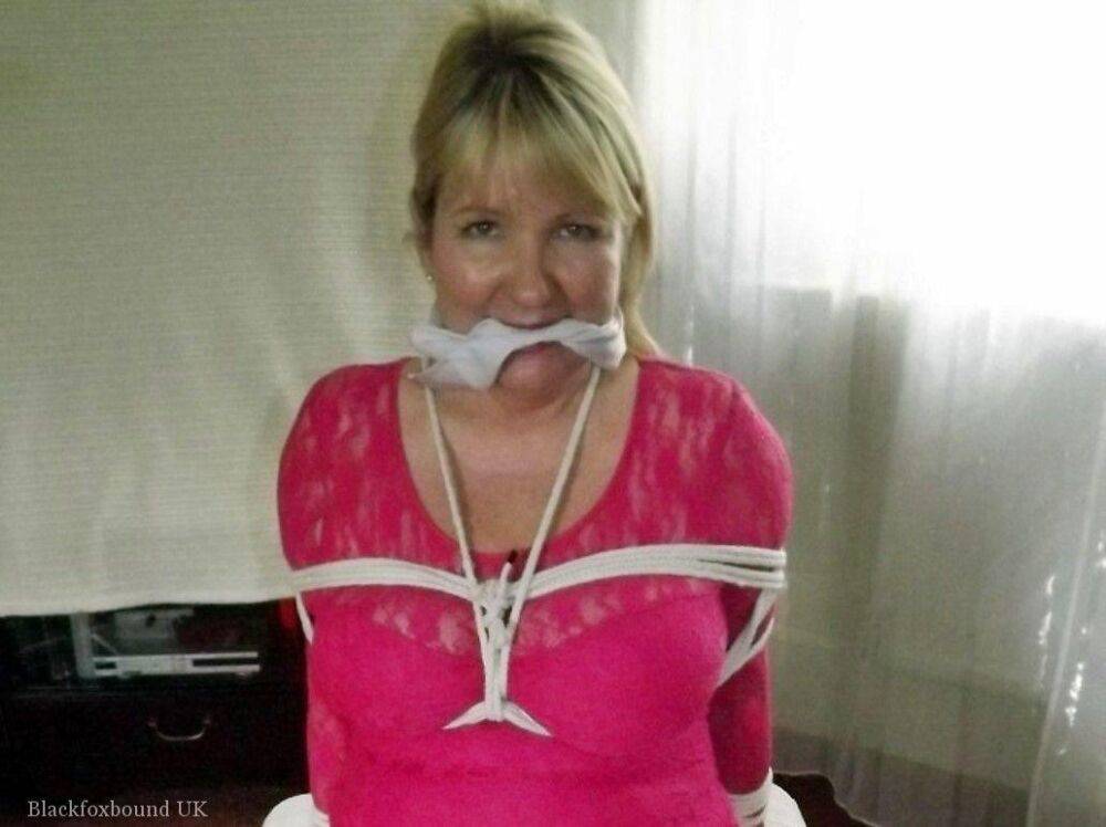 Mature lady with blonde hair ha her big naturals exposed after being tied up - #12