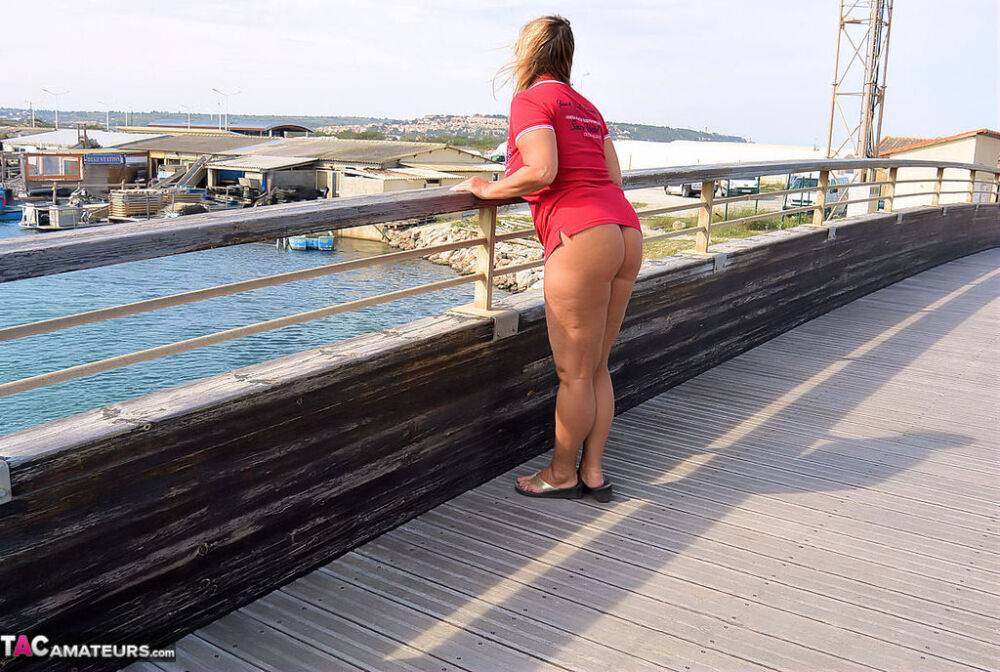 Mature fatty Chrissy walks by the sea with her round big tits bared - #2