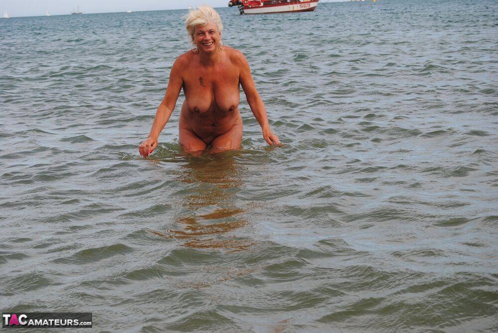 Mature granny Dimonty skinny dipping at the beach with big saggy tits hanging - #13