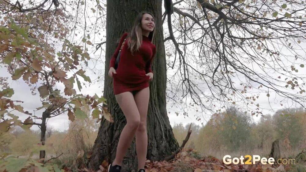 Distressed girl Sasha S hikes up her long dress to pee beside an old tree - #7