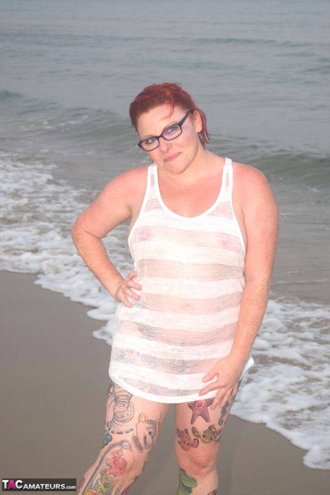 Tattooed redhead wades into the ocean before exposing herself - #13