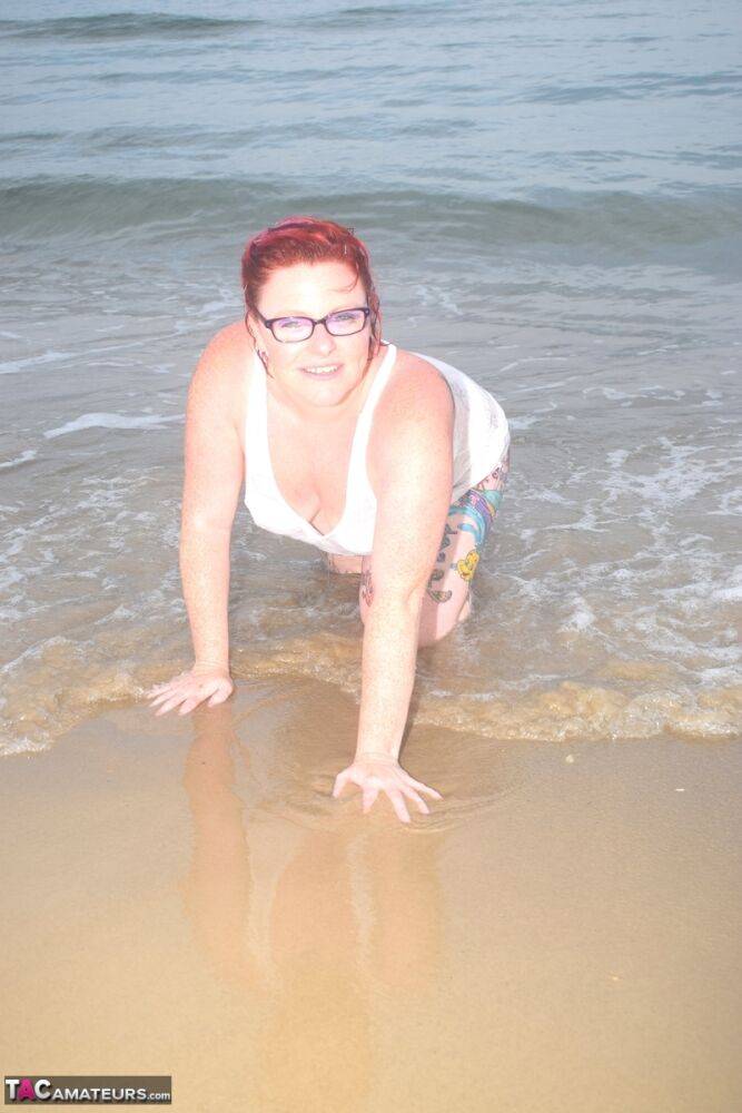 Tattooed redhead wades into the ocean before exposing herself - #2