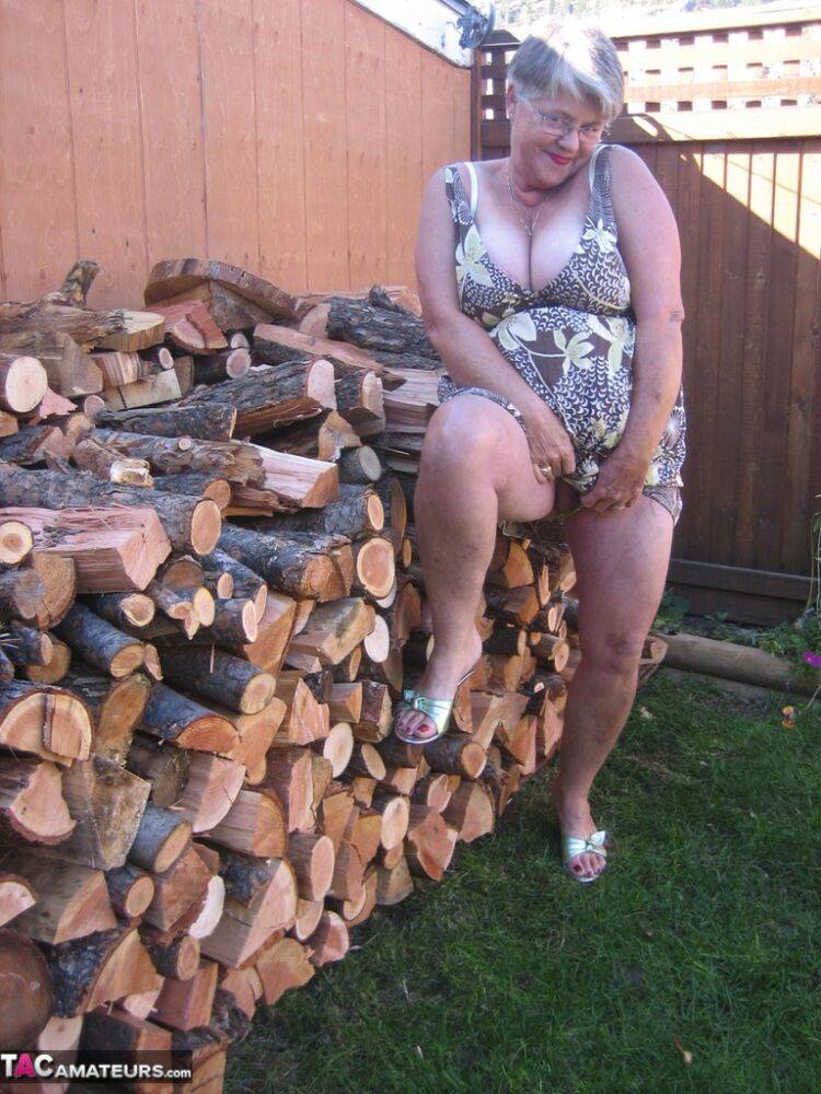 Brazen older granny strips off by the wood pile to show off BBW tits & big ass - #14