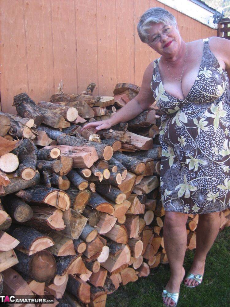 Brazen older granny strips off by the wood pile to show off BBW tits & big ass - #15