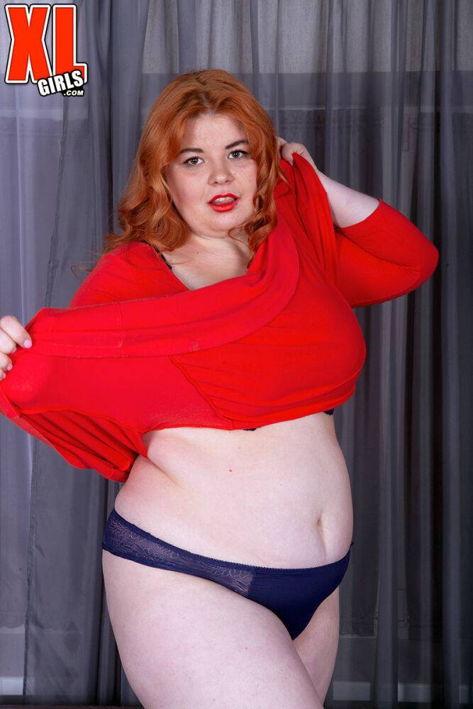 Fat redhead Loida holds her huge boobs after removing red dress and lingerie - #15