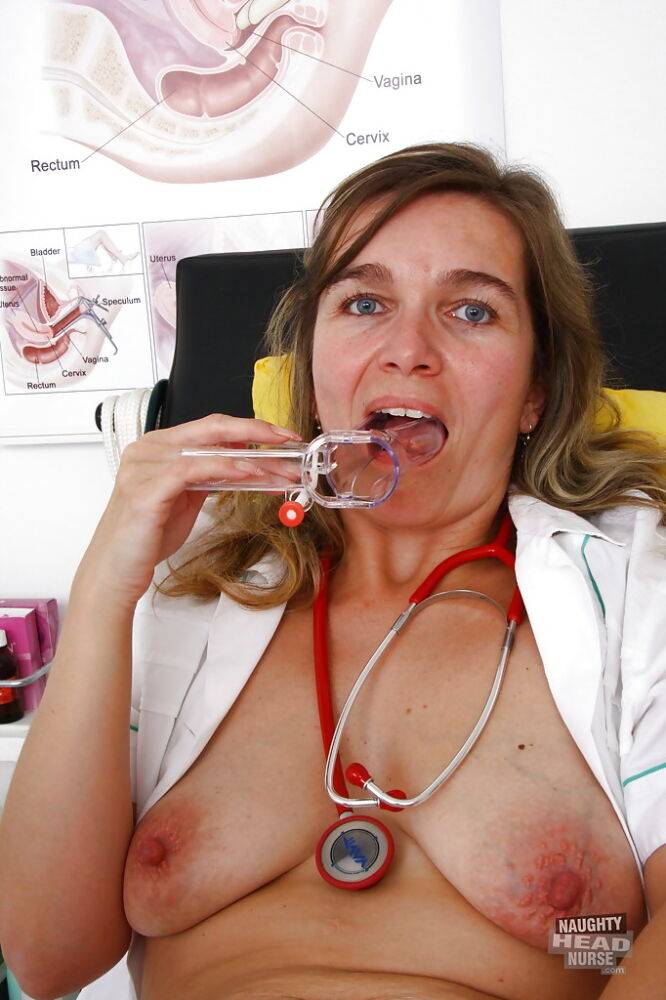 Chubby mature nurse bares saggy tits while inserting speculum in vagina - #3
