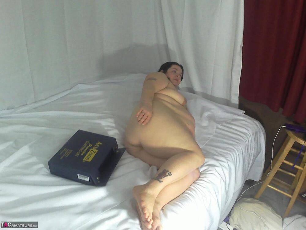 Obese amateur attends to her horny vagina while bare naked on a bed - #13