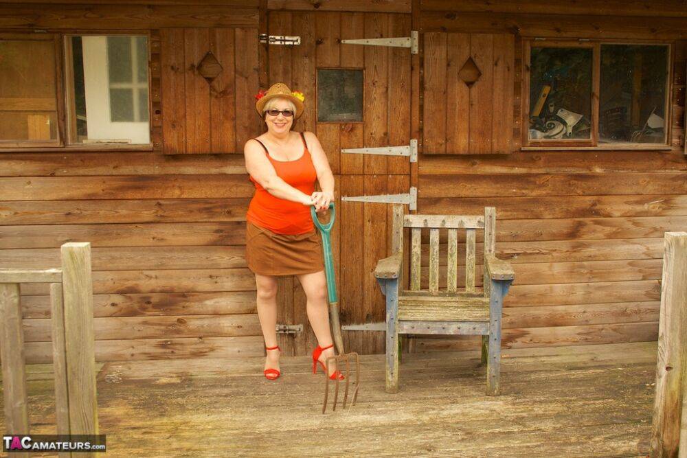 Thick British lady Speedy Bee gets naked on a cabin chair in a hat and heels - #3