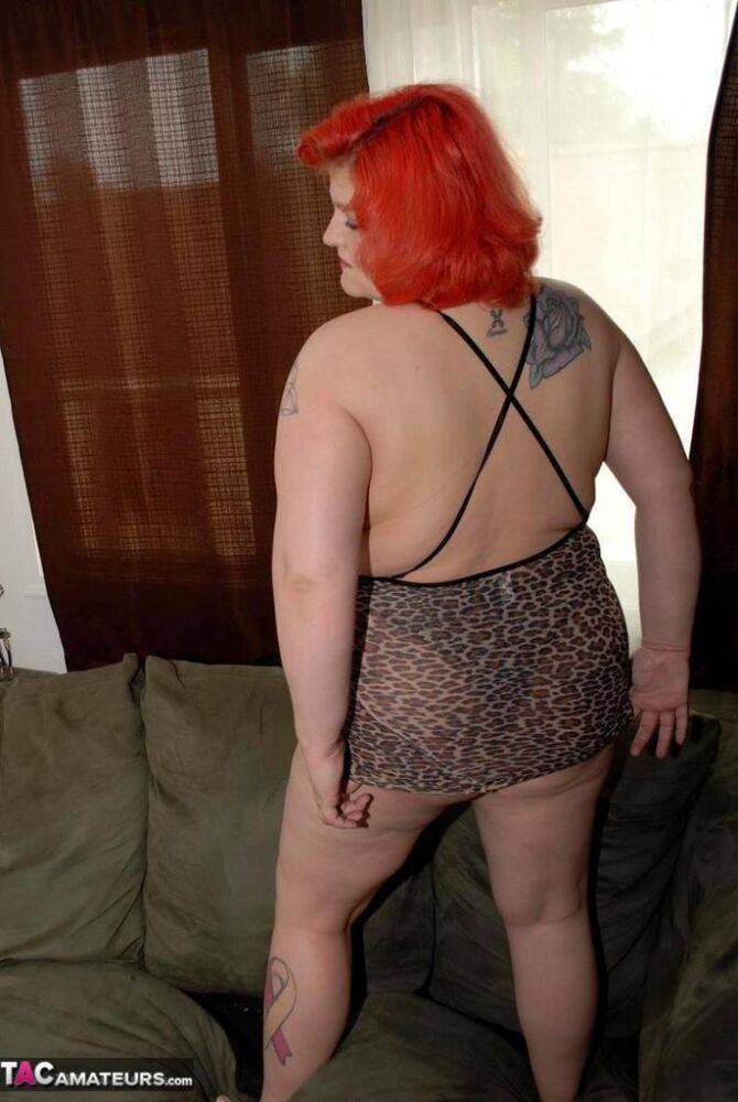 Obese redhead Black Widow AK looses her private parts from lingerie on a couch - #13