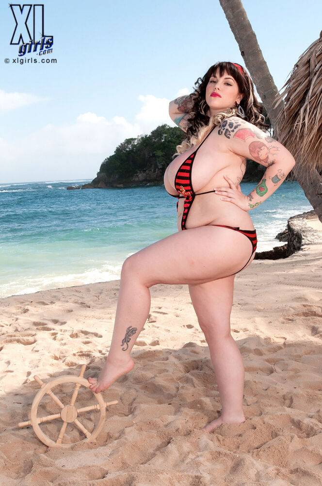 BBW model Dors Feline sets her giant its free of a bikini on a beach - #8