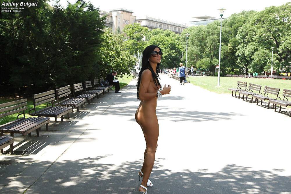 Pretty teenage brunette in sunglasses posing naked in public places - #16