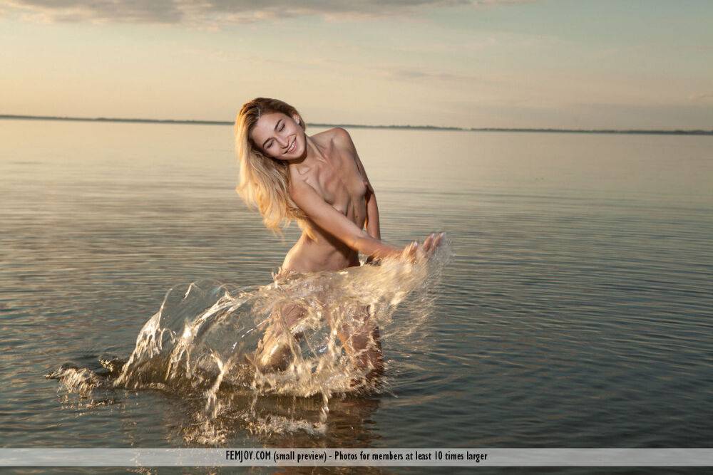 Blonde teen Davina C splashes in the water after getting totally naked - #8