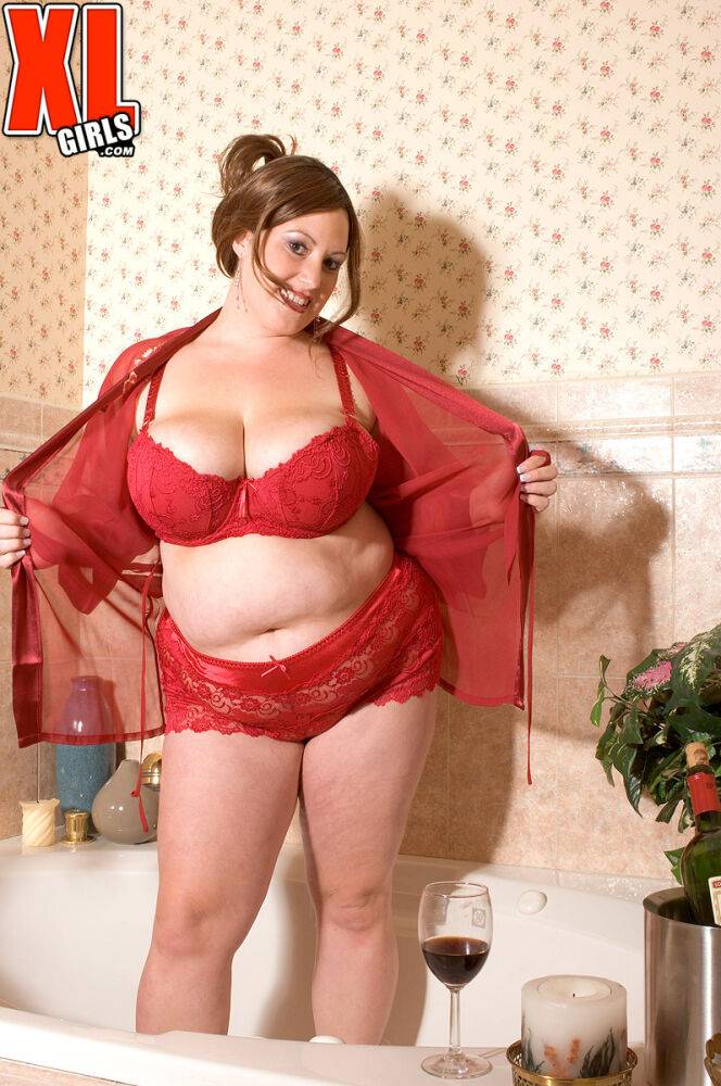 Mature BBW Nikki Cars pulls down her red lace bra freeing a megs set of tits | Photo: 4637886