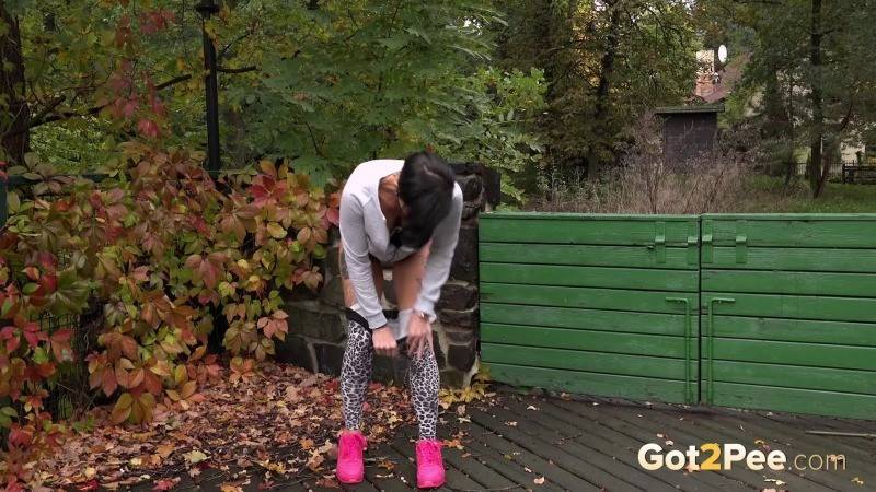 Dark haired babe squats to piss outside - #3