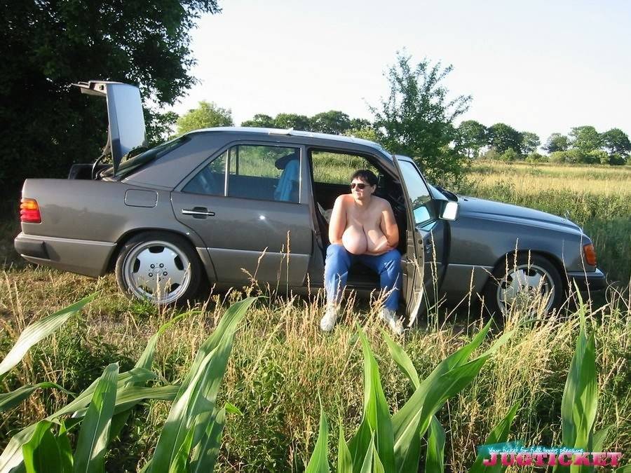 Mature plumper showing her big boobs in the car outdoors - #4