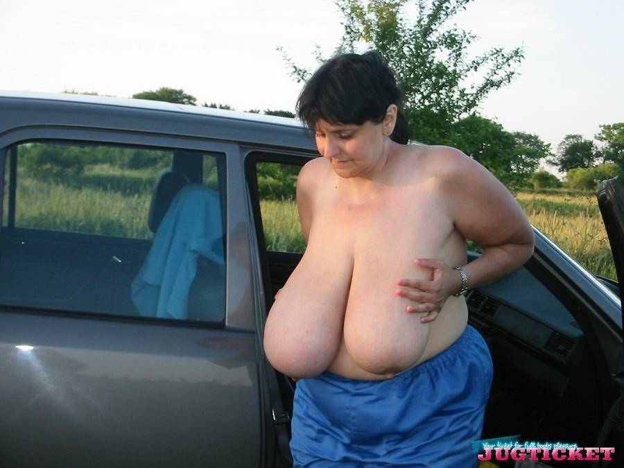 Mature plumper showing her big boobs in the car outdoors - #16