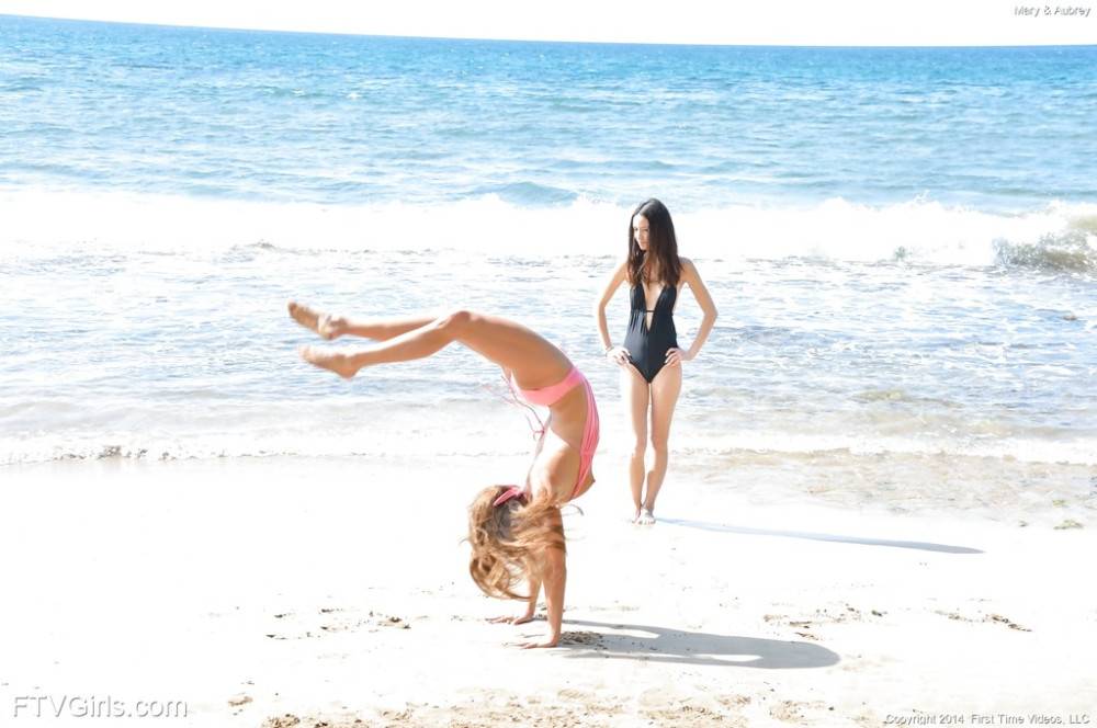 Svelte girls Mary Lynn and Aubrey enjoy a passionate lesbian foreplay on the beach - #10