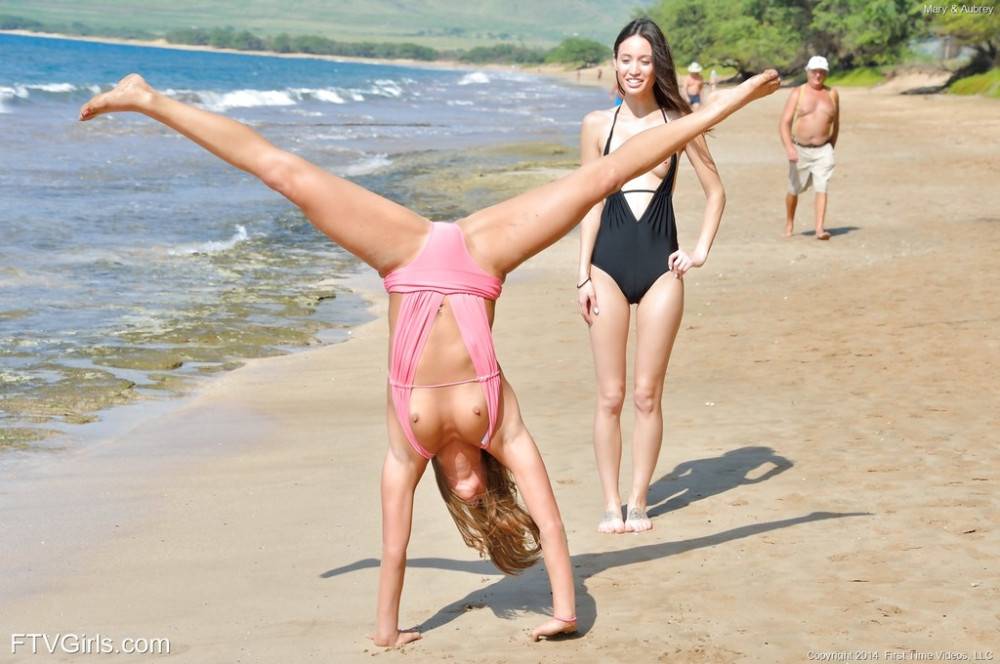 Svelte girls Mary Lynn and Aubrey enjoy a passionate lesbian foreplay on the beach - #15