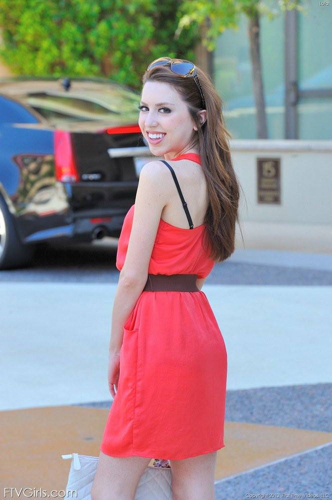 Brunette Lola Milano Is Wearing A Tight Fitting Red Dress And Smiling... - #1